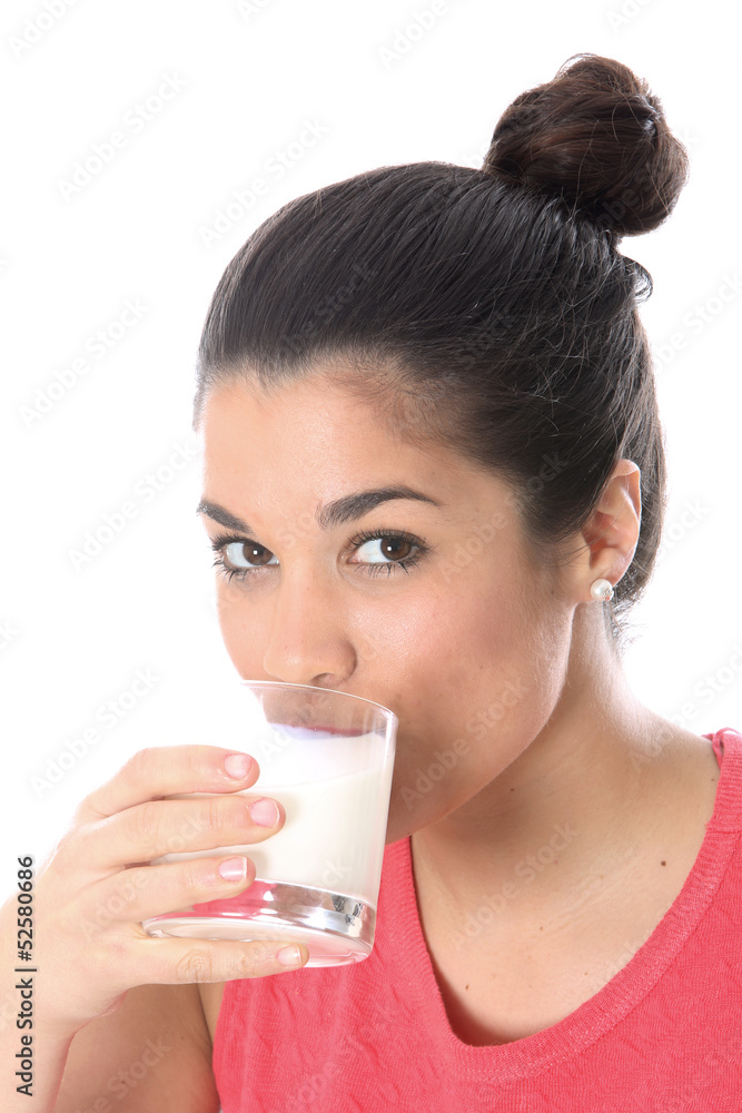 Model Released. Young Woman Drinking a Glass of Milk Model Released. Young Woman Drinking a Glass of Milk