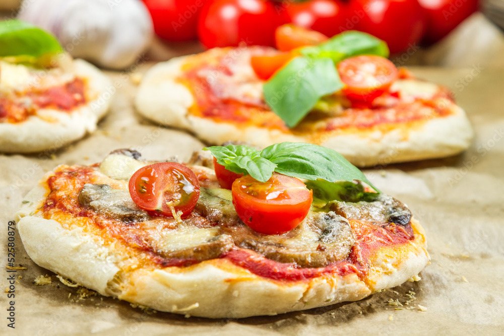 Close-up on freshly baked mini pizzas Close-up on freshly baked mini pizzas