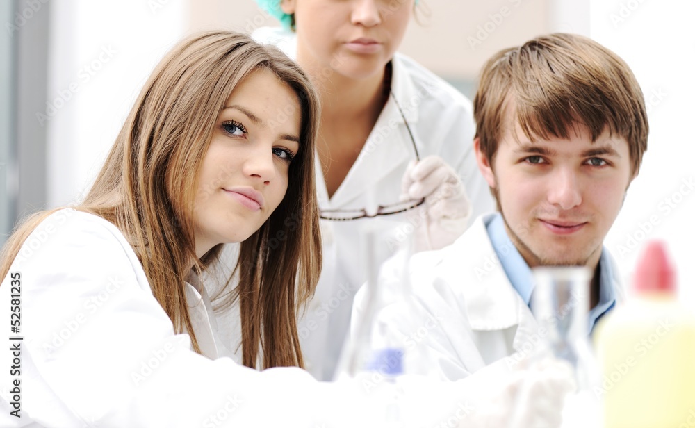 Young science workers research at medical lab Young science workers research at medical lab