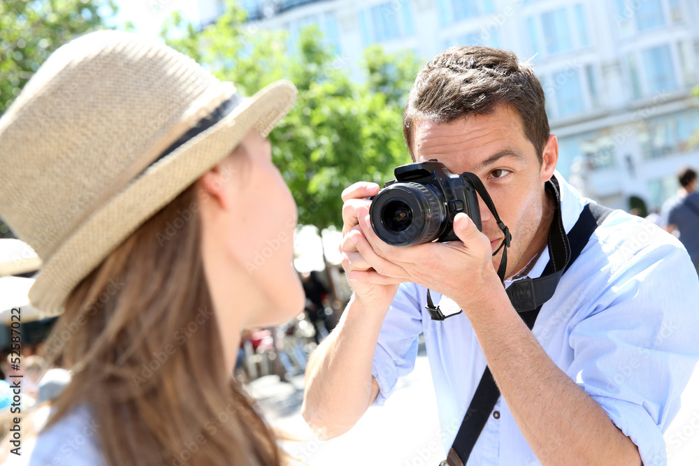 Man taking picture of girlfriend during week-end Man taking picture of girlfriend during week-end
