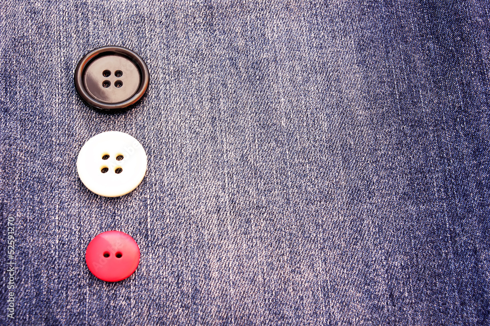 buttons on a gray blue jeans background buttons on a gray blue jeans background