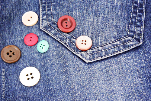 buttons on a soft blue jeans background