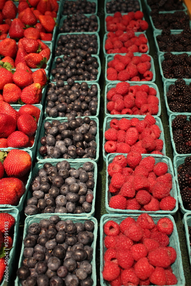 Blue cartons with fresh seasonal berries Blue cartons with fresh seasonal berries