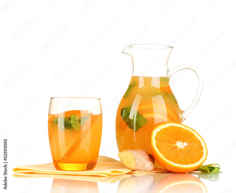 Orange lemonade in pitcher and glass isolated on white Orange lemonade in pitcher and glass isolated on white