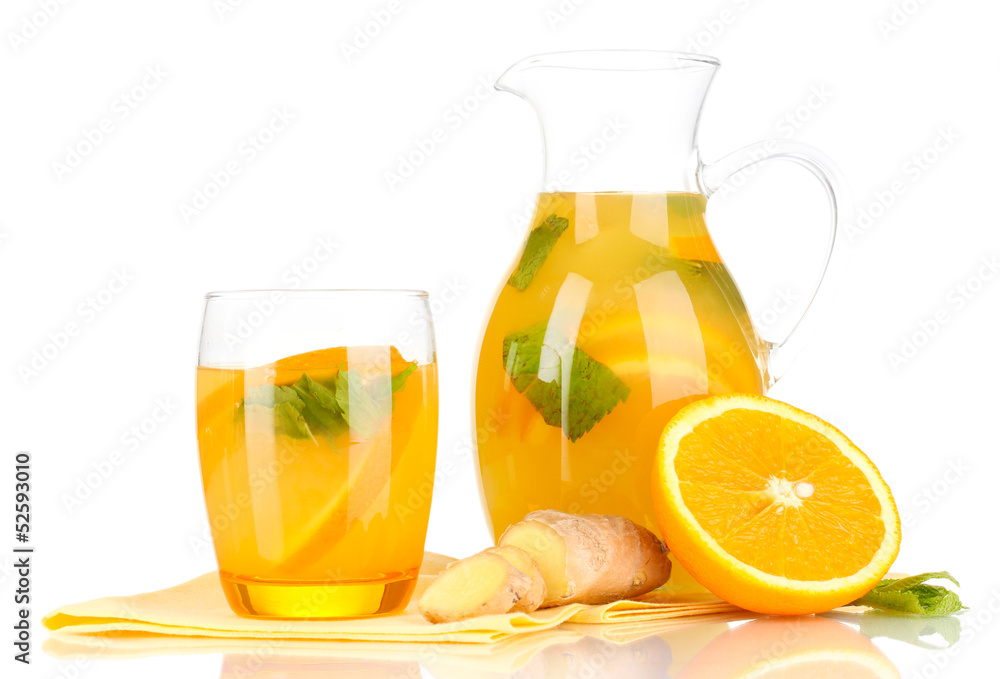 Orange lemonade in pitcher and glass isolated on white Orange lemonade in pitcher and glass isolated on white