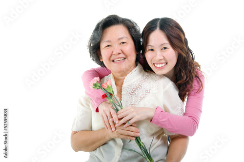 Asian women holding carnation flowers
