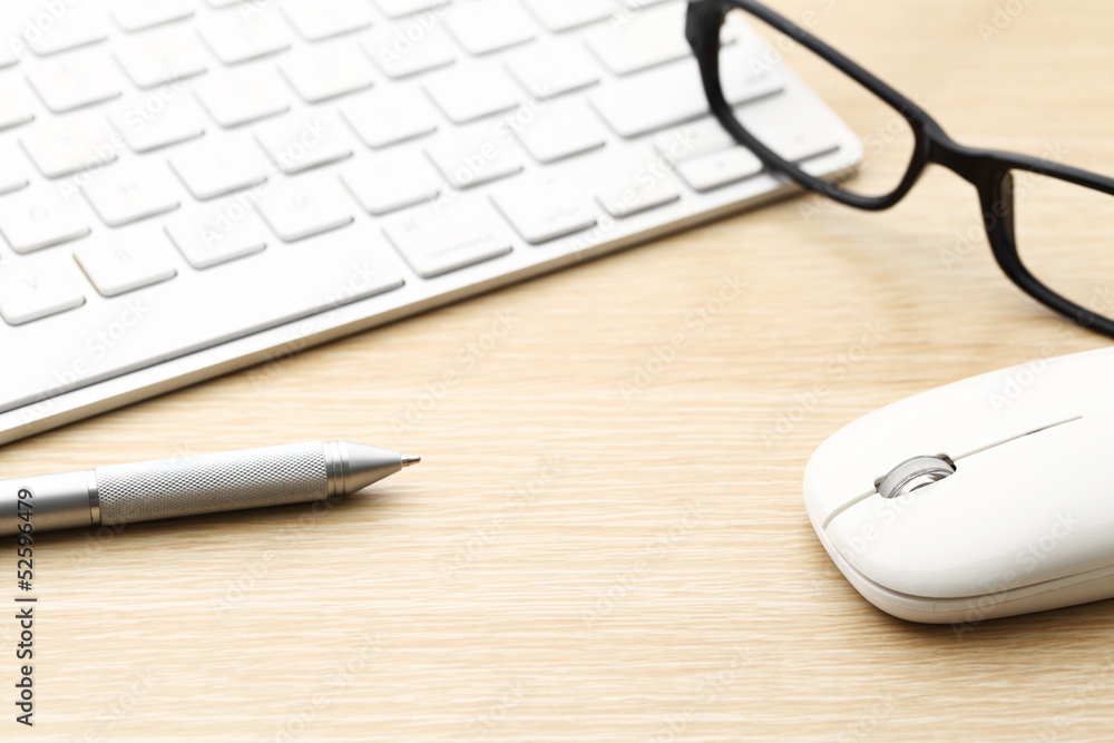 Keyboard, pen, mouse and glasses on the working desk Keyboard, pen, mouse and glasses on the working desk