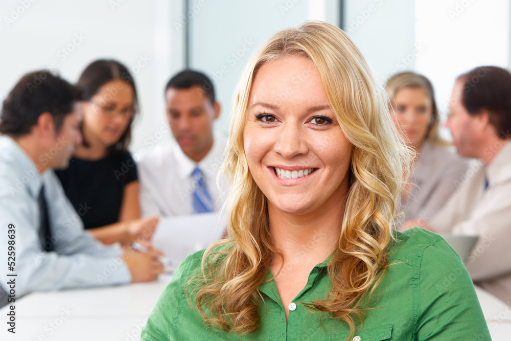 Portrait Of Businesswoman Sitting At Boardroom Table Portrait Of Businesswoman Sitting At Boardroom Table