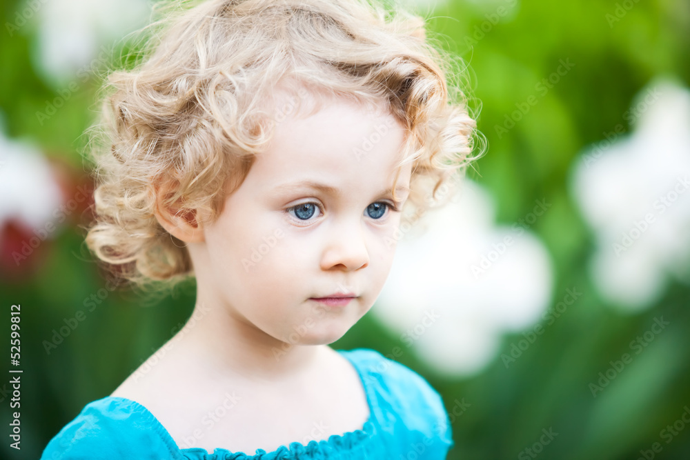Adorable little girl taken closeup outdoors in summer Adorable little girl taken closeup outdoors in summer