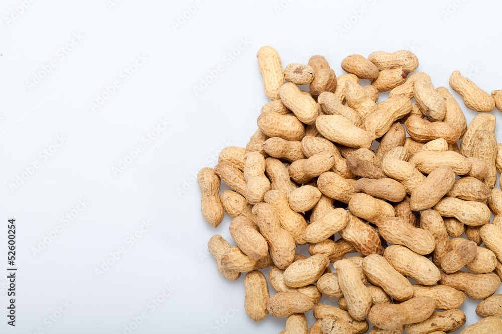 .Dried peanuts in closeup on the white background .Dried peanuts in closeup on the white background