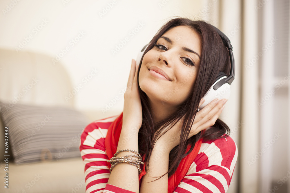 Young woman in bright outfit enjoying the music at home Young woman in bright outfit enjoying the music at home