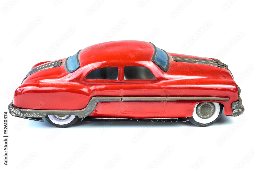 Fifties vintage red car toy isolated on white