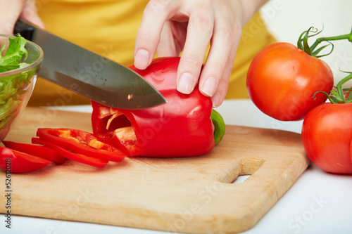 Female hands cooking vegetables 