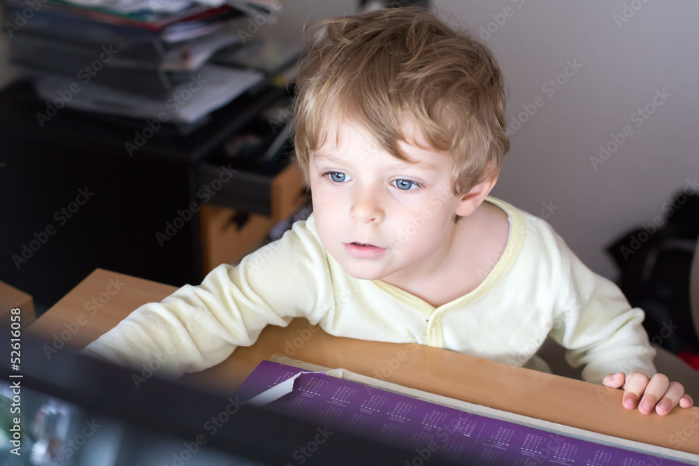 little boy learning on computer at home little boy learning on computer at home
