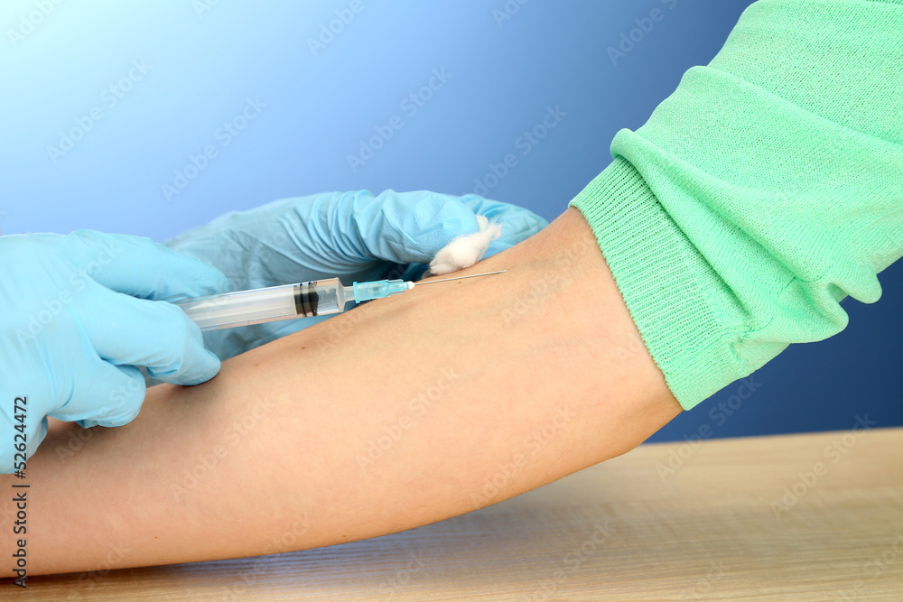 Doctor holding syringe with a vaccine in the patient hand, Doctor holding syringe with a vaccine in the patient hand,