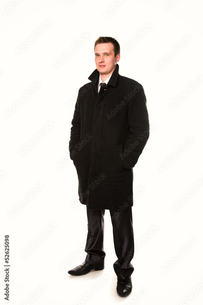 Handsome young businessman in a coat isolated Handsome young businessman in a coat isolated