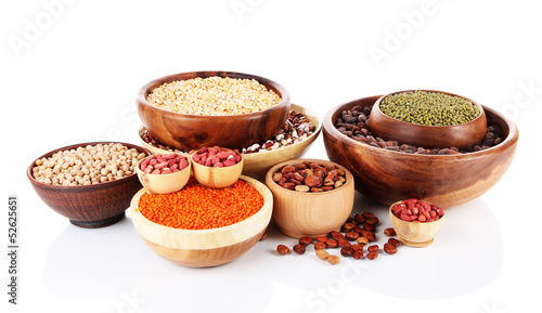 Different kinds of beans in bowls isolated on white