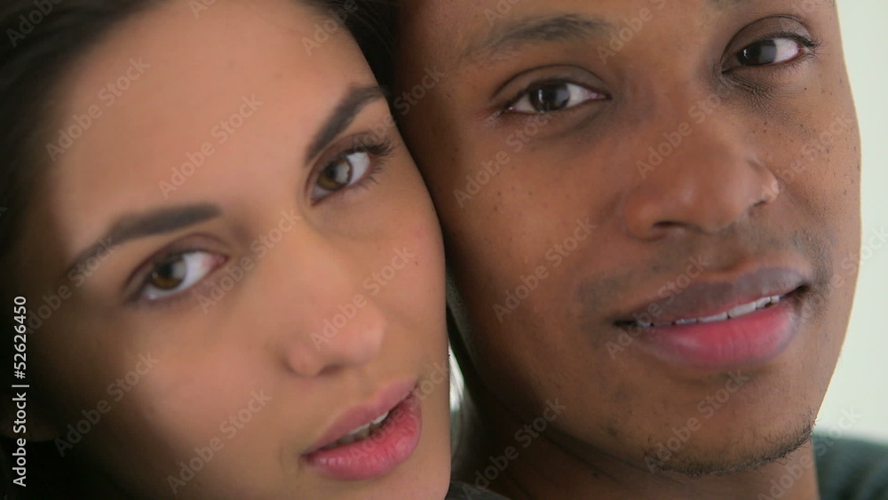 Happy African American and Caucasian couple smiling Happy African American and Caucasian couple smiling