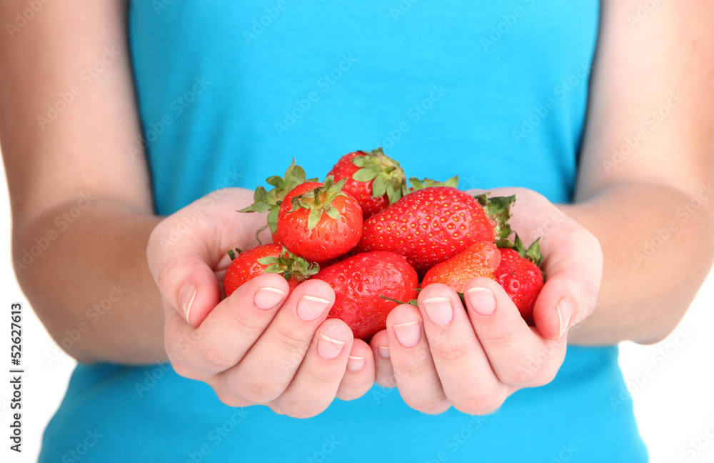 Obraz premium Girl holding fresh strawberry in bowl close up