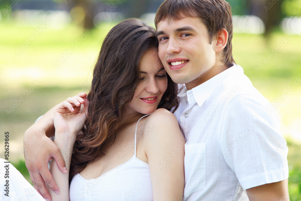 Young love Couple smiling under blue sky Young love Couple smiling under blue sky