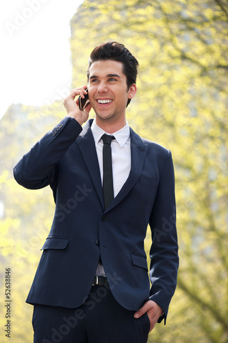 Businessman walking and talking on the phone