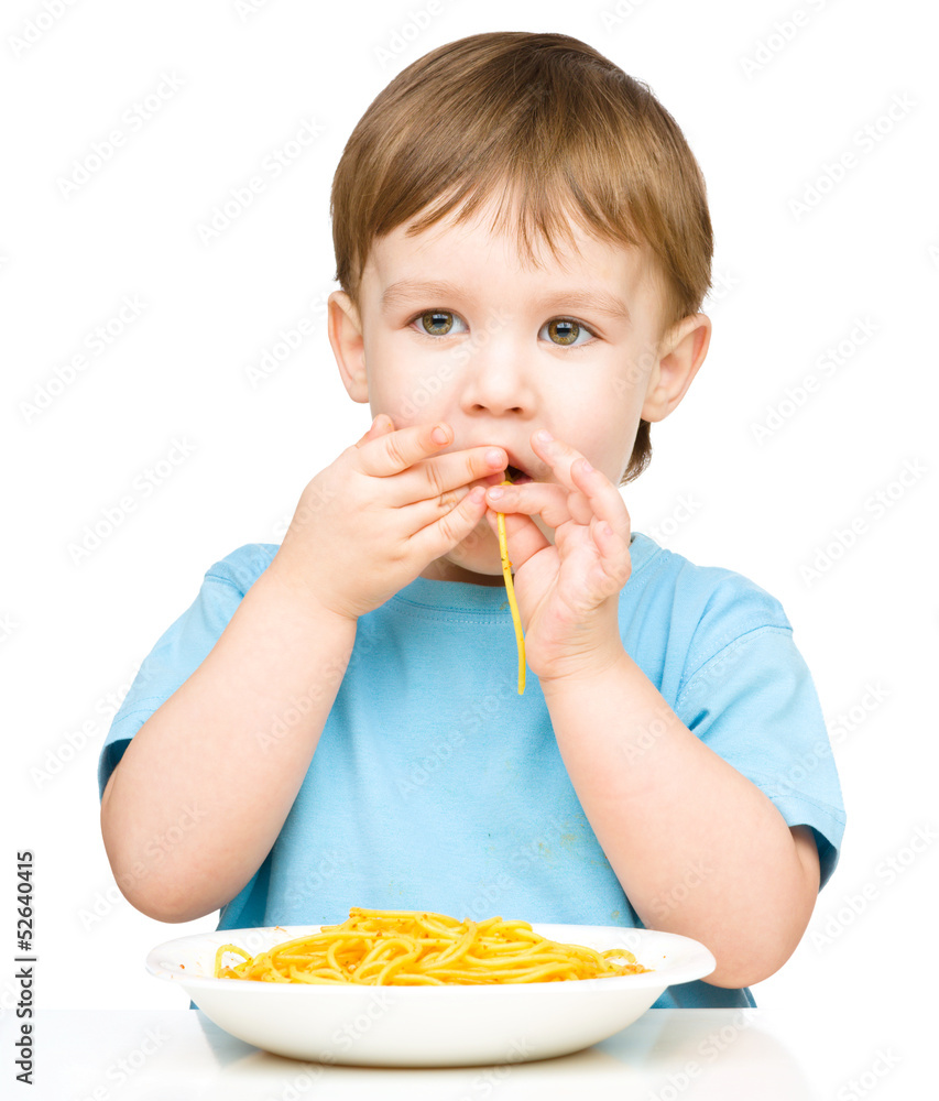 Little boy is eating spaghetti Little boy is eating spaghetti
