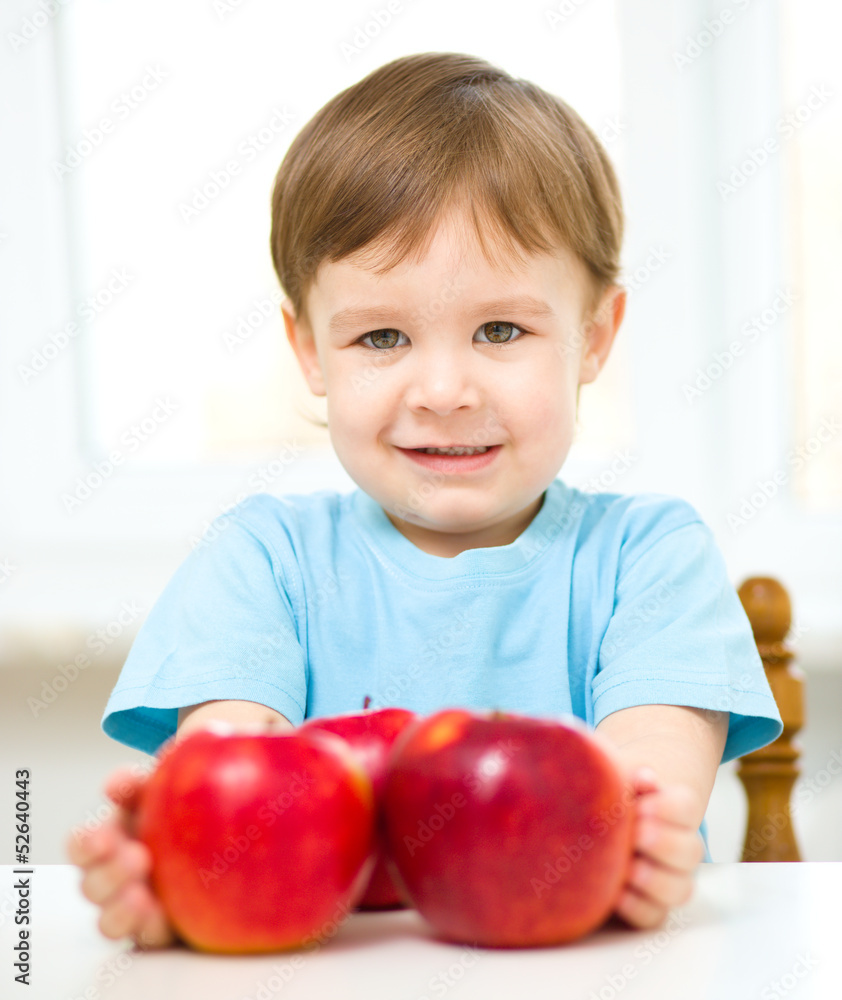 Portrait of a happy little boy with apples Portrait of a happy little boy with apples