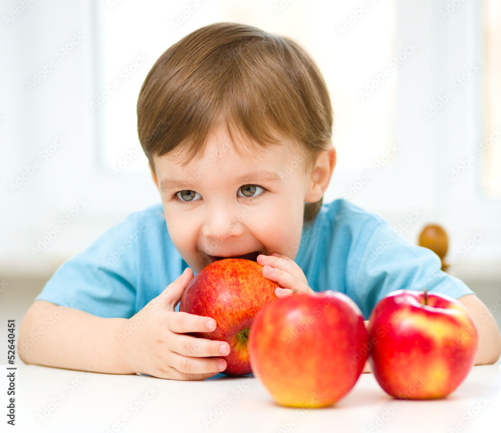 Portrait of a happy little boy with apples Portrait of a happy little boy with apples