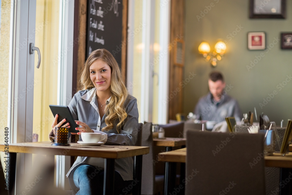 Pregnant Woman With Digital Tablet At Table Pregnant Woman With Digital Tablet At Table