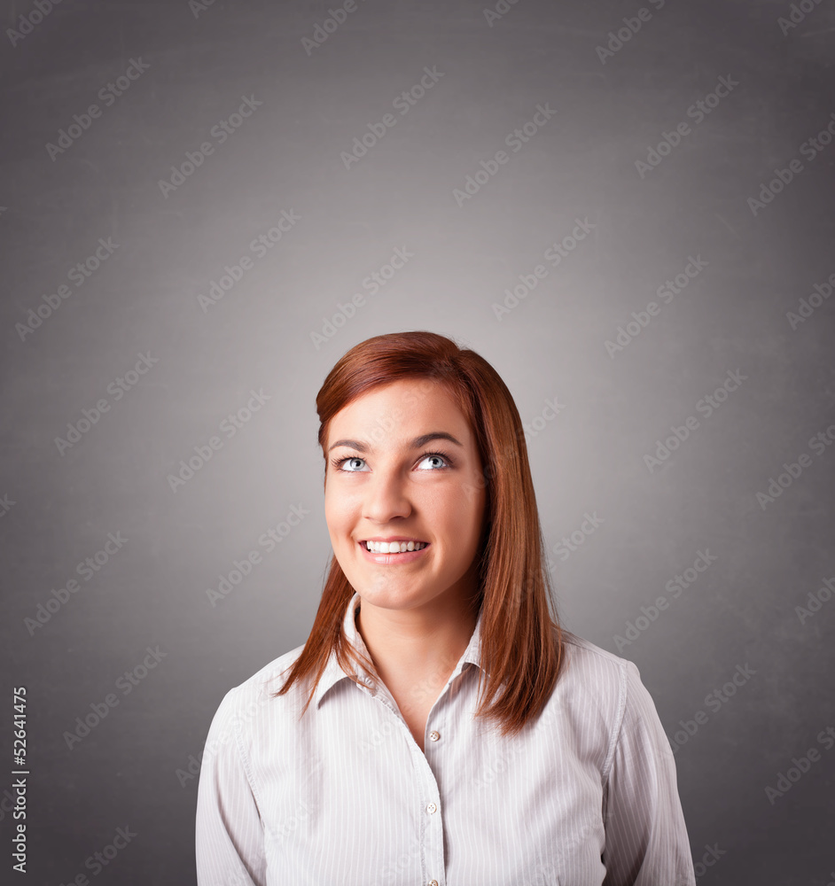 Young woman standing and thinking with copy space Young woman standing and thinking with copy space