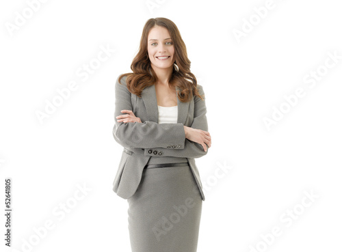 Smiling businesswoman with her arms crossed