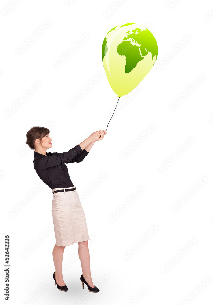 Happy lady holding a green globe balloon Happy lady holding a green globe balloon