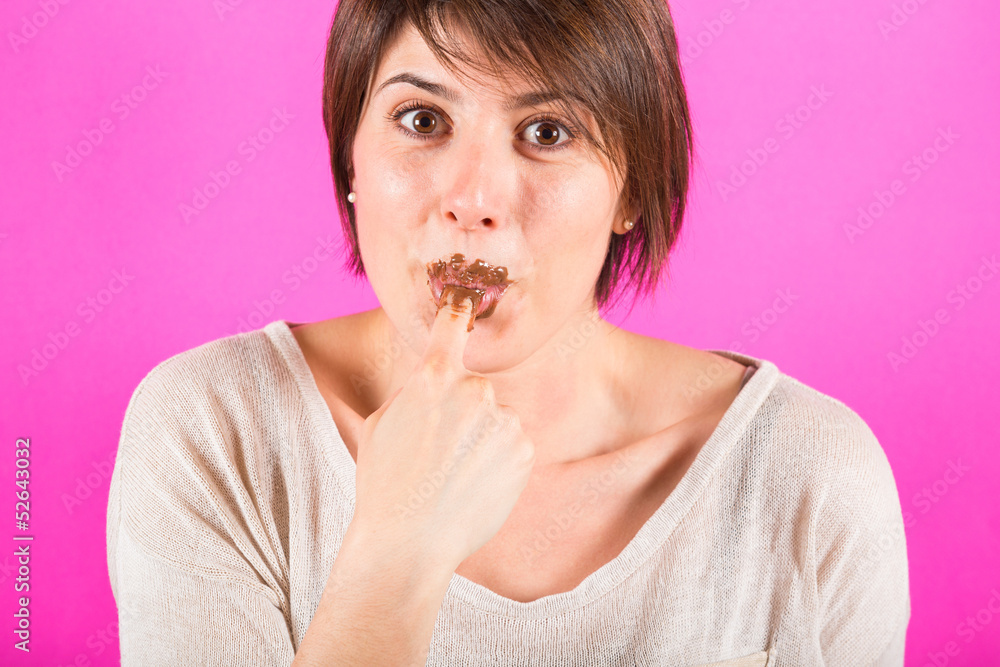 Young Woman Eating Chocolate Cream Young Woman Eating Chocolate Cream