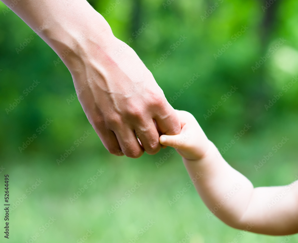 Hands of mother and daughter holding each other Hands of mother and daughter holding each other