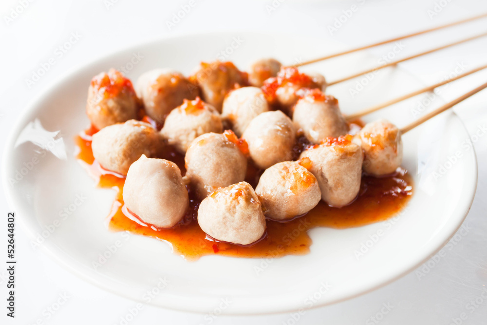 Mini pork balls in white plate on clean table Mini pork balls in white plate on clean table