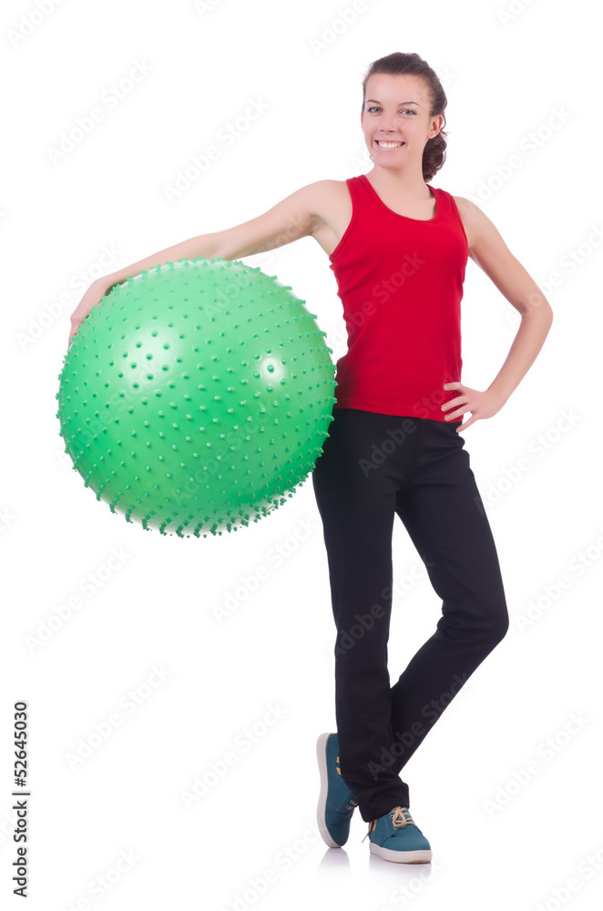 Young woman with ball exercising on white