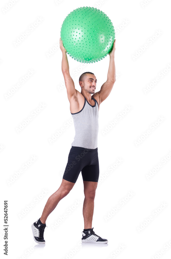 Man with swiss ball doing exercises on white Man with swiss ball doing exercises on white