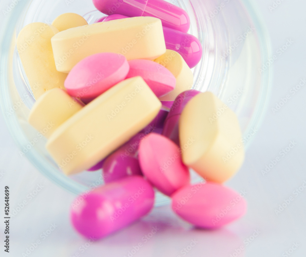 Medicine tablet in prescription glass Medicine tablet in prescription glass