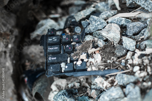 broken black keyboard on the trash