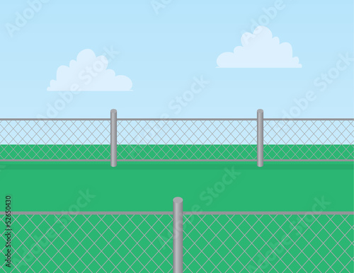 Chain linked fence in grassy field