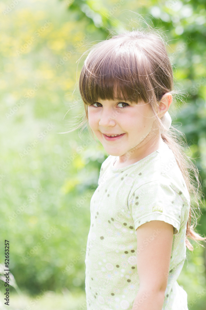 Little girl standing in the grass Little girl standing in the grass