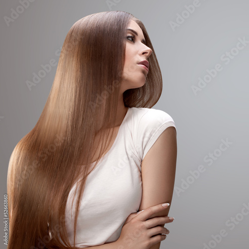 Long Hair. Beautiful Woman with Healthy Brown Hair.