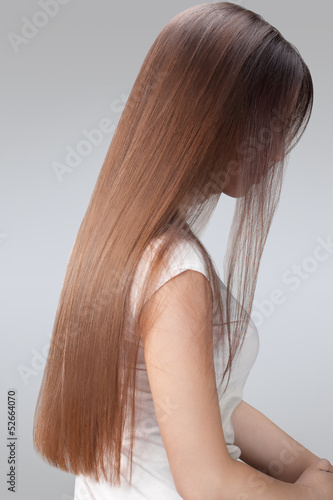 Long Hair. Beautiful Woman with Healthy Brown Hair.