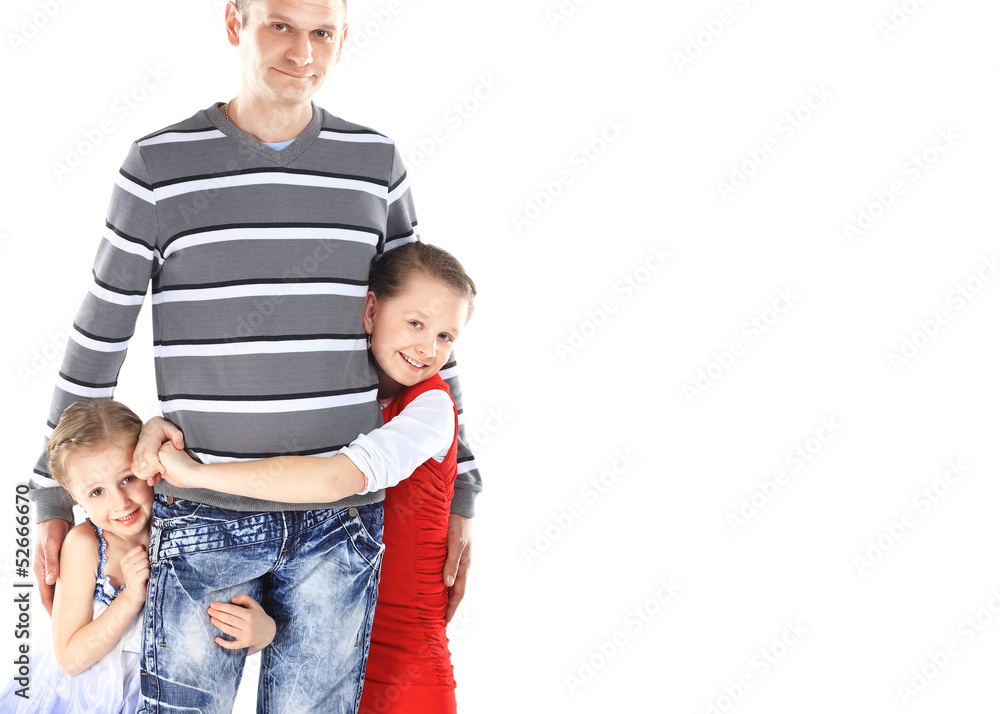 Doting father and his two adorable daughters posing together Doting father and his two adorable daughters posing together