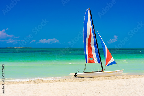 Colorful sailing boat in a cuban beach