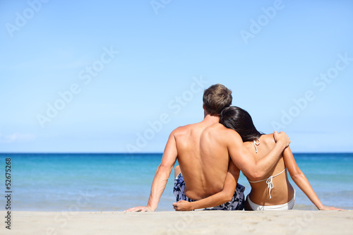Happy young couple in love relaxing beach vacation