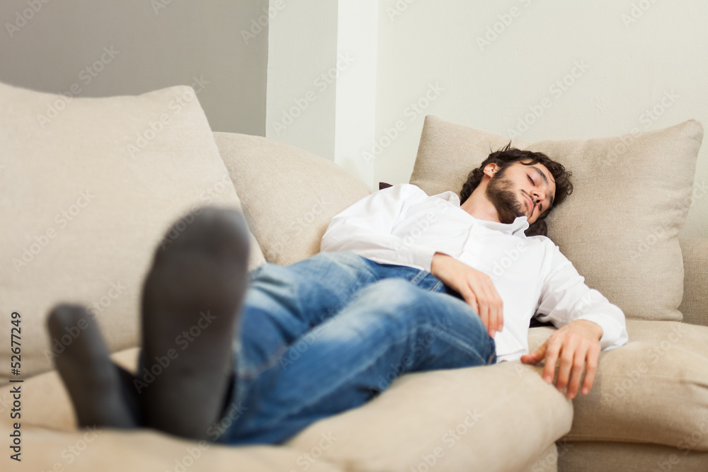 Man relaxing on his couch Man relaxing on his couch