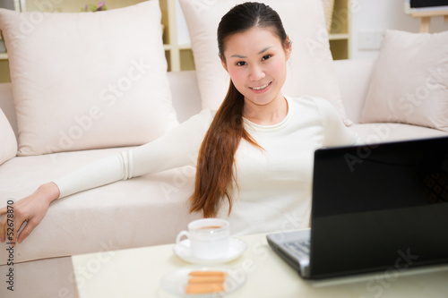 young asian woman using a laptop