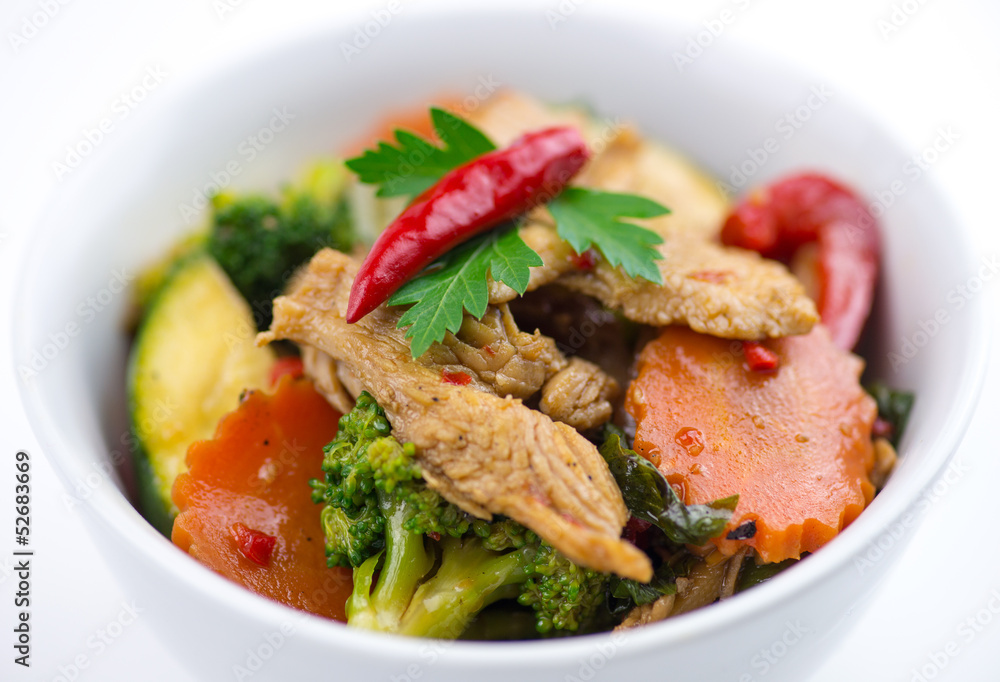 Closeup of spicy chicken Thai basil with seasonal vegetables Closeup of spicy chicken Thai basil with seasonal vegetables