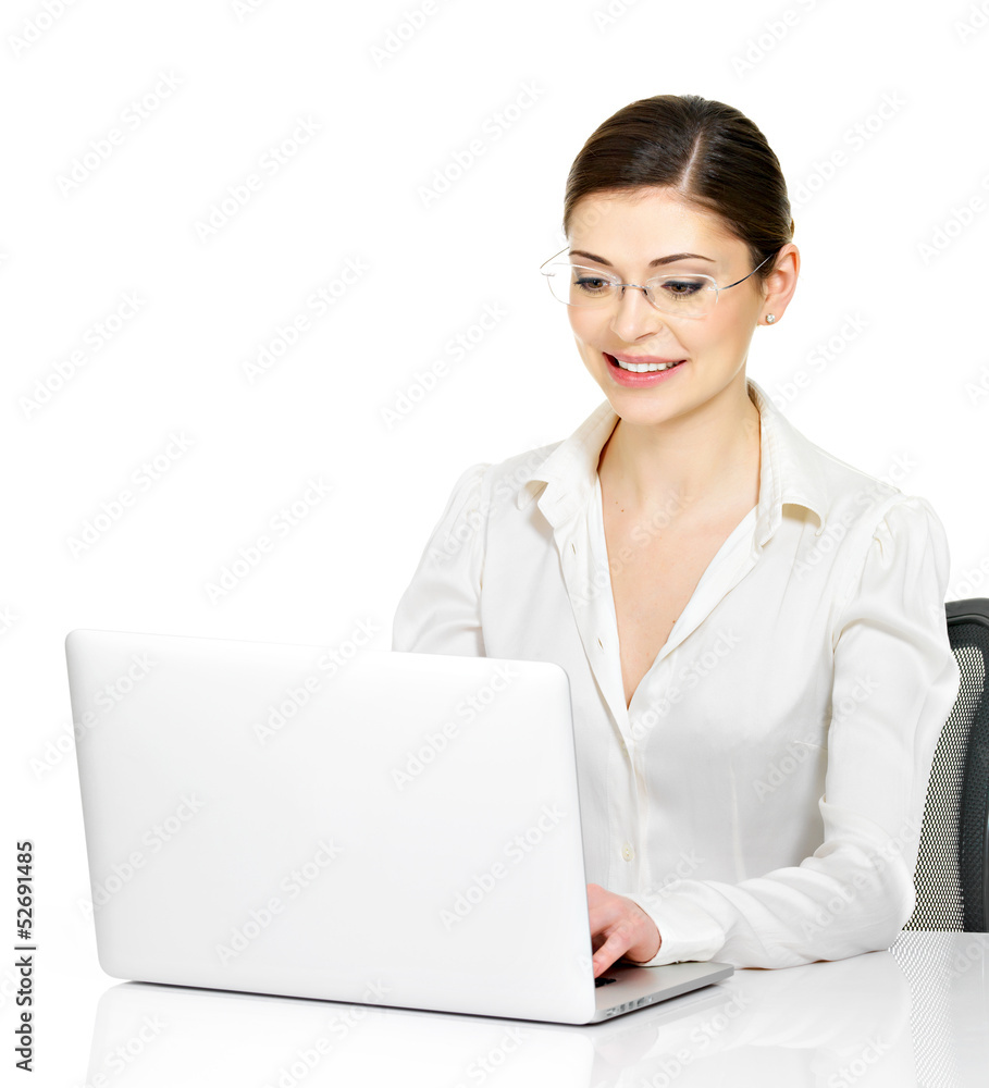 woman sits from the table with laptop in white shirt woman sits from the table with laptop in white shirt